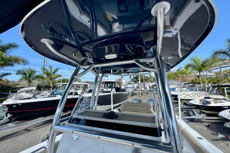 Slide: The Image of 2017 Sportsman Heritage 251 Center Console boat with T-top, surrounded by other boats. - 33