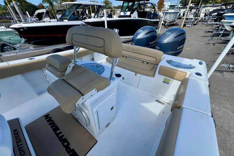 Slide: The Image of 2017 Sportsman Heritage 251 Center Console boat interior with seating and Yamaha engines. - 36