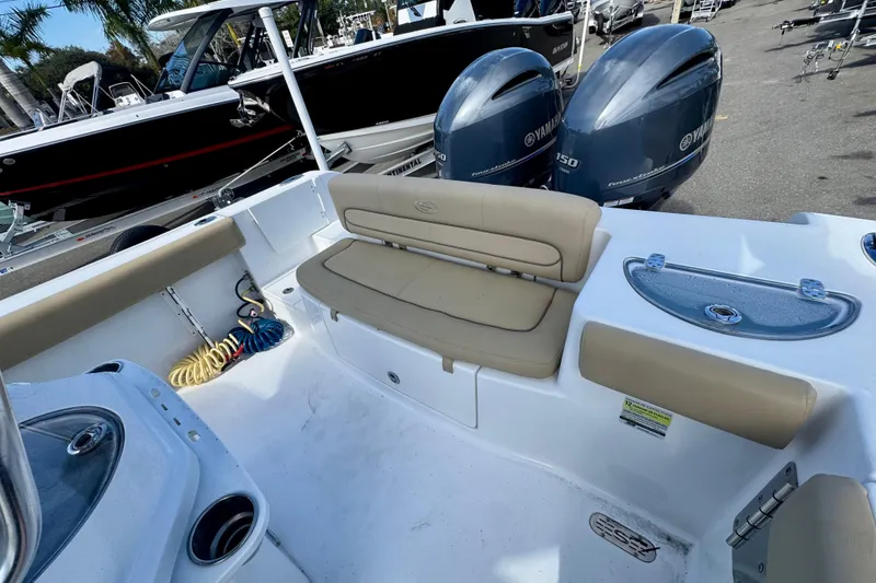 Slide: The Image of 2017 Sportsman Heritage 251 Center Console boat interior with seating and dual Yamaha engines. - 37