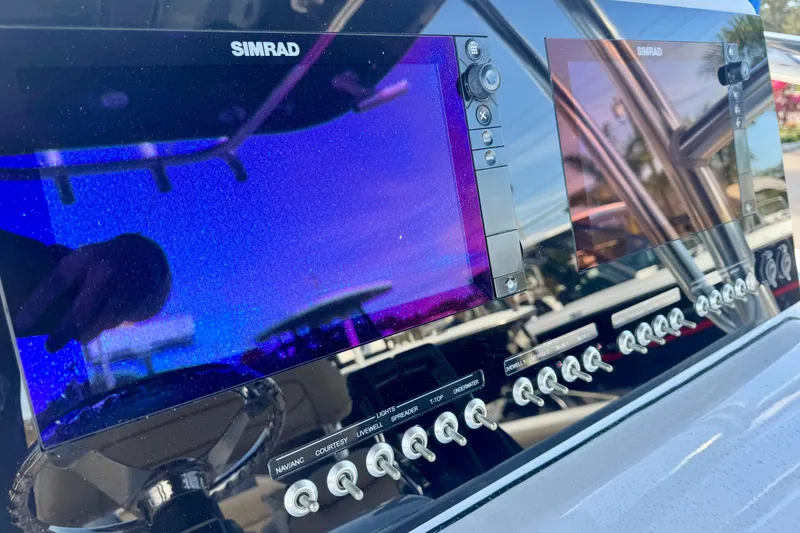 Slide: The Image of Control panel of 2017 Sportsman Heritage 251 Center Console with Simrad displays. - 38