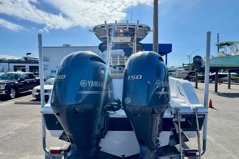 Slide: The Image of 2017 Sportsman Heritage 251 Center Console with twin Yamaha 150 engines at a dealership. - 5