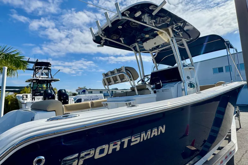 Slide: The Image of 2017 Sportsman Heritage 251 Center Console boat under clear blue sky. - 7