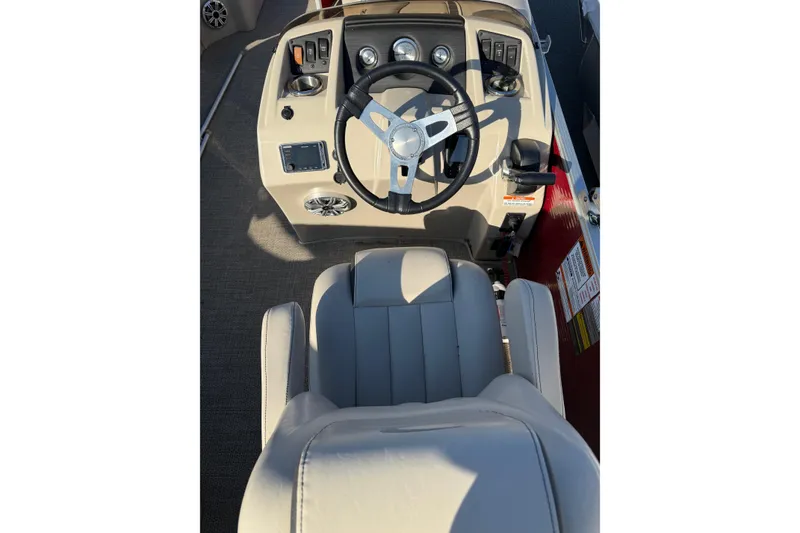 Slide: The Image of 2019 Bennington SX 20 SLX boat helm with steering wheel and controls. - 2