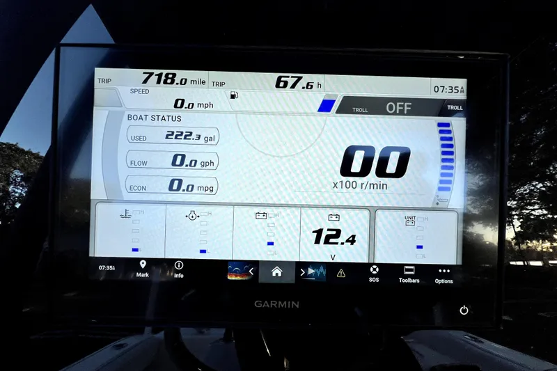 Slide: The Image of Garmin display on 2022 Cobia 220 Center Console showing trip and boat status. - 20