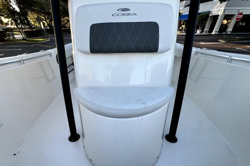 Slide: The Image of 2022 Cobia 220 Center Console boat interior with cushioned seating and sleek design. - 42