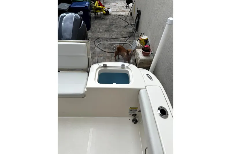 Slide: The Image of Propeller of 2022 Cobia 220 Center Console boat on asphalt surface. - 6