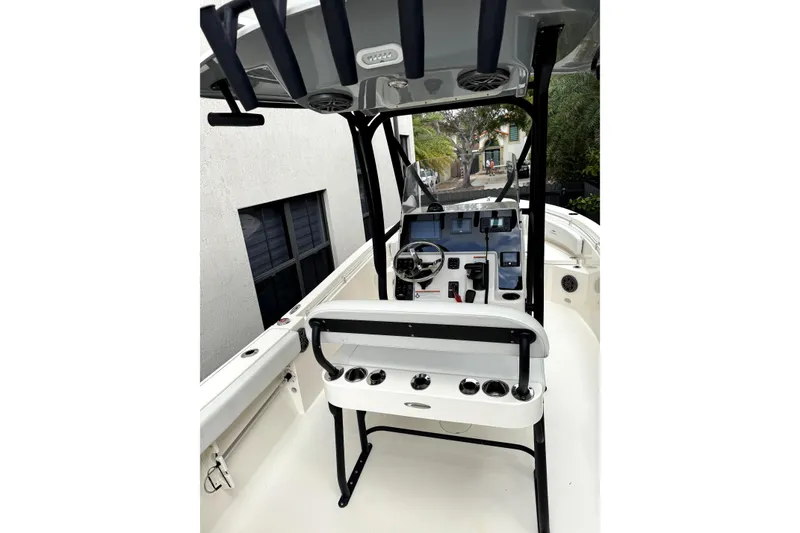 Slide: The Image of Propeller of 2022 Cobia 220 Center Console boat on asphalt surface. - 7