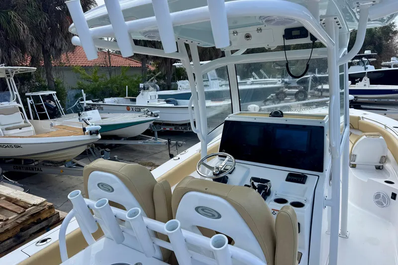 Slide: The Image of 2021 Sportsman Open 282 Center Console boat with modern helm and seating. - 13