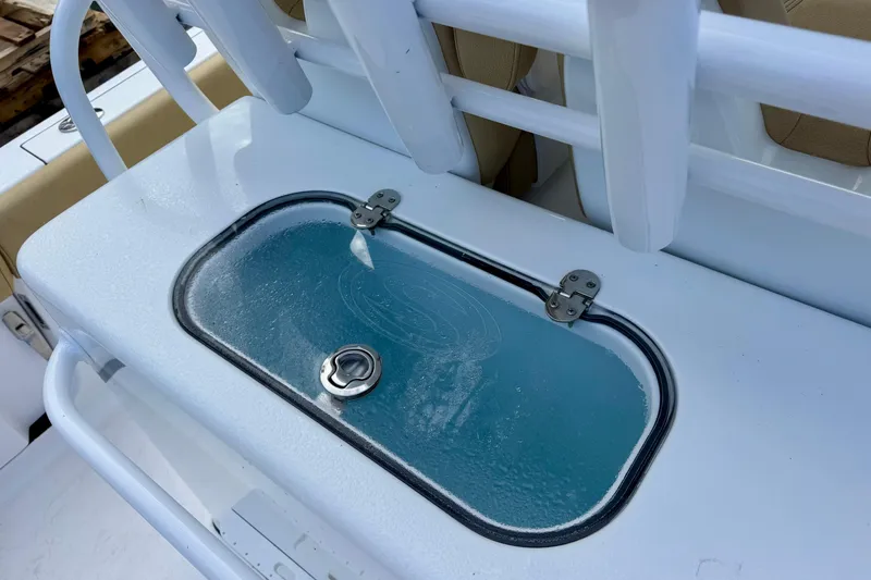 Slide: The Image of 2021 Sportsman Open 282 Center Console livewell with transparent lid and secure latch. - 16