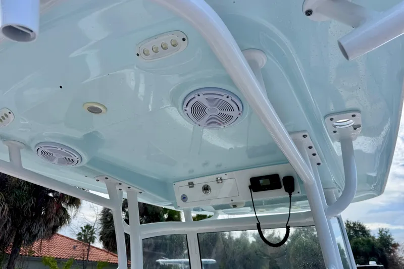 Slide: The Image of 2021 Sportsman Open 282 Center Console boat interior with speakers and electronic controls. - 20