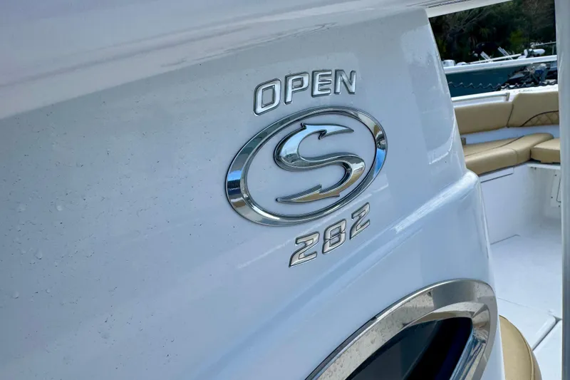 Slide: The Image of 2021 Sportsman Open 282 Center Console boat interior with logo detail. - 22