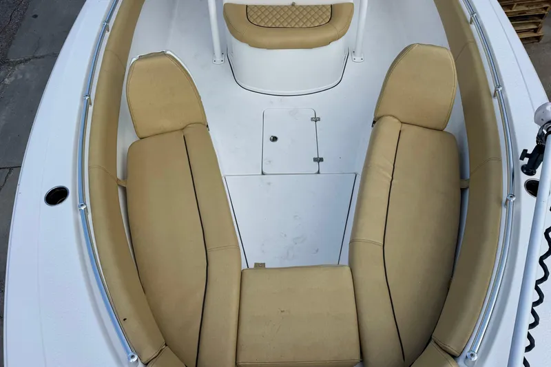 Slide: The Image of 2021 Sportsman Open 282 Center Console boat with tan seating and white deck. - 27