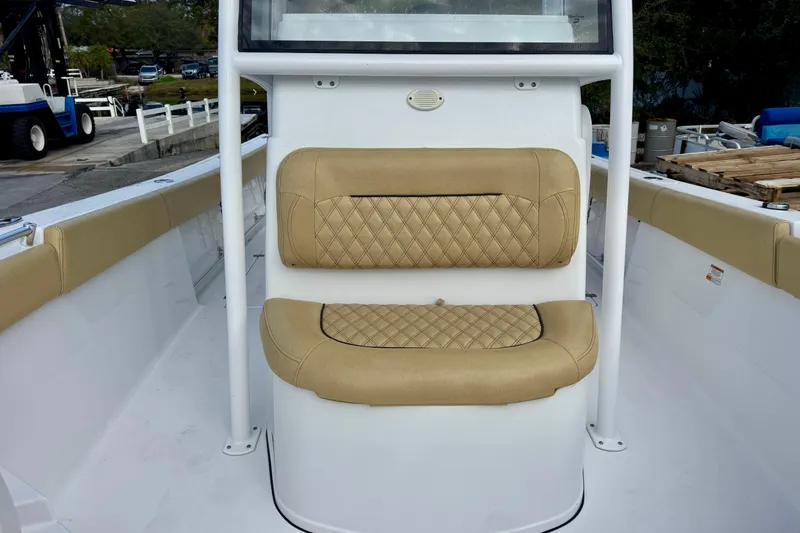 Slide: The Image of 2021 Sportsman Open 282 Center Console with tan cushioned seating. - 29