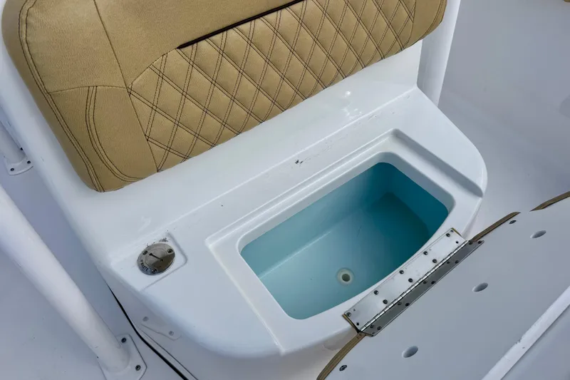 Slide: The Image of 2021 Sportsman Open 282 Center Console boat seat with storage compartment. - 31