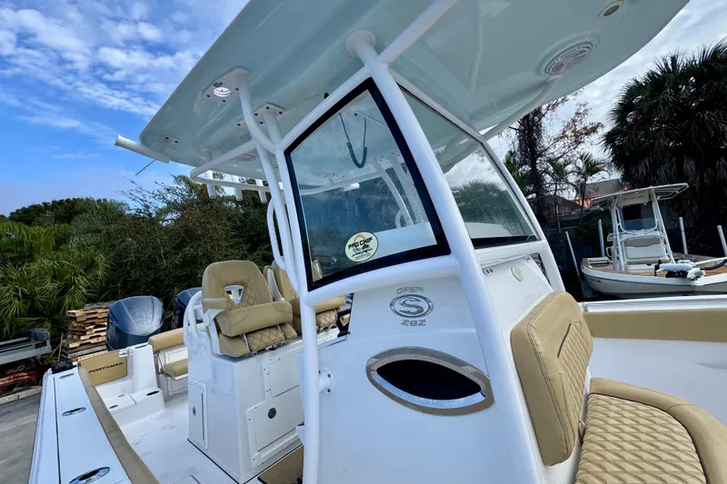 Slide: The Image of 2021 Sportsman Open 282 Center Console boat with tan seating and sleek design. - 33