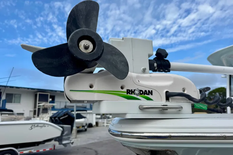 Slide: The Image of Rhodan trolling motor on 2021 Sportsman Open 282 Center Console boat, clear sky background. - 7