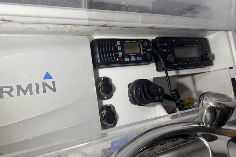 Slide: The Image of Control panel of 2010 SeaCraft 20 SF with Garmin navigation and communication equipment. - 11