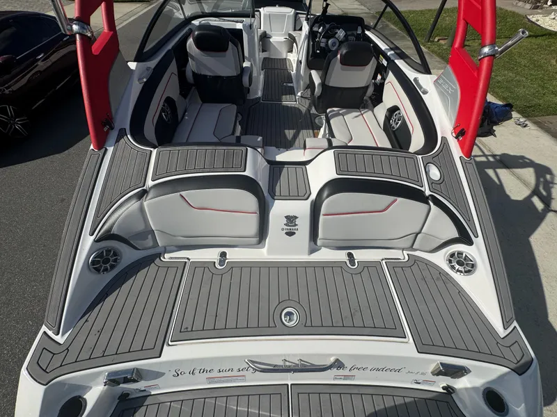 Slide: The Image of 2018 Yamaha Boats 212X interior with sleek seating and modern dashboard design. - 21