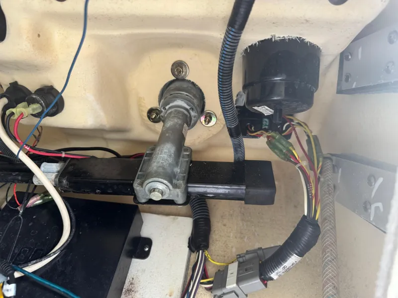 Slide: The Image of Engine compartment wiring of a 2018 Yamaha Boats 212X, showing cables and components. - 38