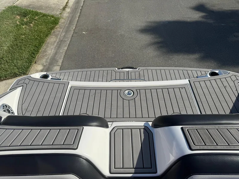 Slide: The Image of 2018 Yamaha Boats 212X swim platform with gray decking, viewed from above. - 47