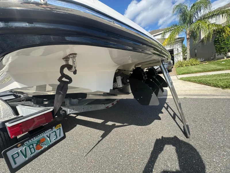 Slide: The Image of 2018 Yamaha Boats 212X rear view with trailer, ladder, and Florida license plate. - 9