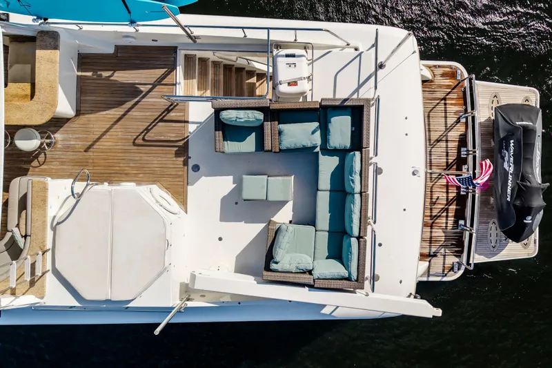 Slide: The Image of 2006 Cheoy Lee 84 Bravo yacht "Family Time" with jet ski, cruising on a scenic waterway. - 11