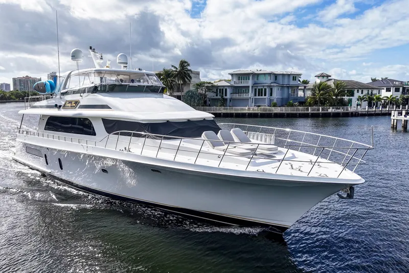 Slide: The Image of 2006 Cheoy Lee 84 Bravo yacht cruising on a scenic waterway. - 13