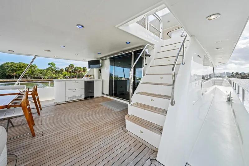 Slide: The Image of Luxurious 2006 Cheoy Lee 84 Bravo yacht deck with modern amenities and scenic water view. - 21