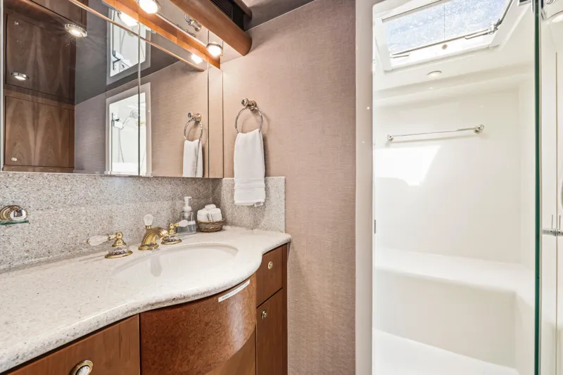 Slide: The Image of Luxurious bedroom interior of 2006 Cheoy Lee 84 Bravo yacht with elegant wood finishes. - 42