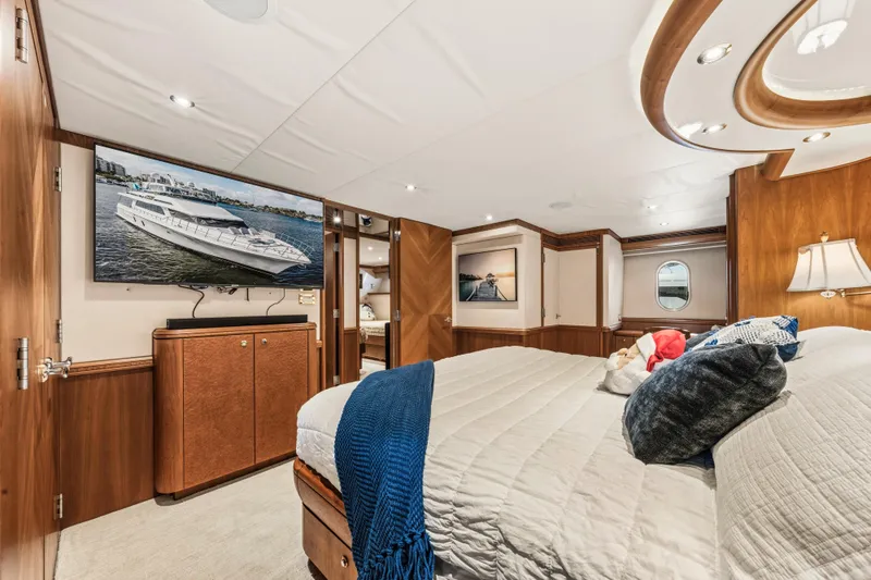 Slide: The Image of Luxurious 2006 Cheoy Lee 84 Bravo yacht bedroom with elegant wood paneling and cozy decor. - 46