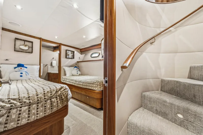 Slide: The Image of Luxurious 2006 Cheoy Lee 84 Bravo yacht cabin with cozy bed and elegant wood finishes. - 49