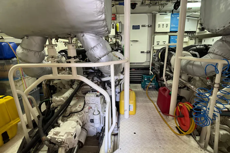Slide: The Image of Engine room of 2006 Cheoy Lee 84 Bravo yacht, showcasing mechanical components and equipment. - 56