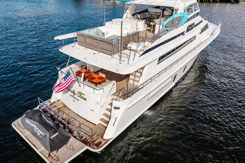 Slide: The Image of Cheoy Lee 84 Bravo 2006 yacht "Family Time" cruising with American flag and jet ski. - 7