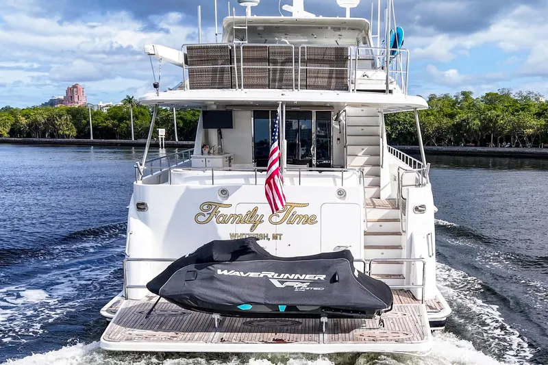 Slide: The Image of Luxury 2006 Cheoy Lee 84 Bravo yacht cruising on a scenic waterway. - 12