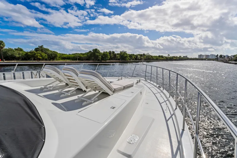 Slide: The Image of 2006 Cheoy Lee 84 Bravo yacht cruising on a sunny day with scenic waterfront views. - 18