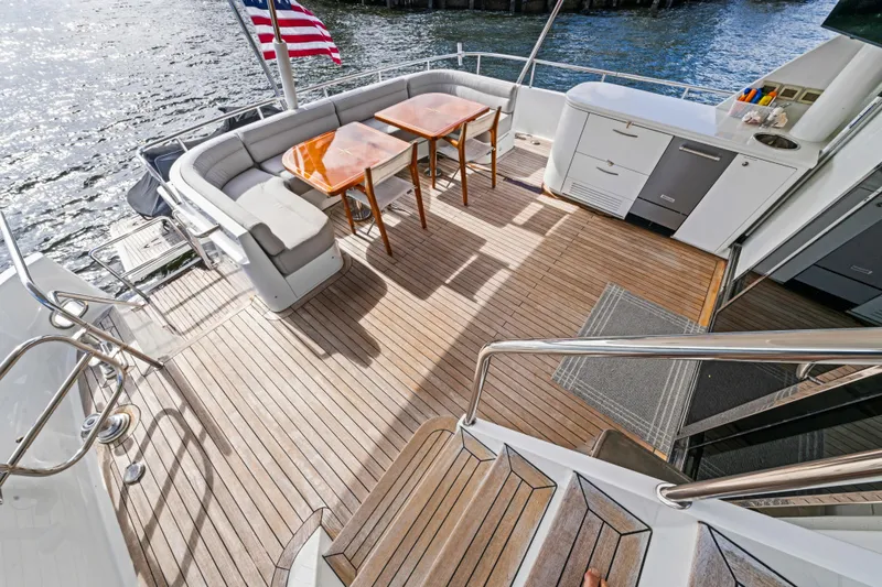 Slide: The Image of Luxurious 2006 Cheoy Lee 84 Bravo yacht deck with seating and bar area. - 25