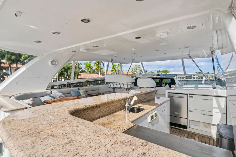 Slide: The Image of Luxurious 2006 Cheoy Lee 84 Bravo yacht interior with elegant seating and scenic views. - 28