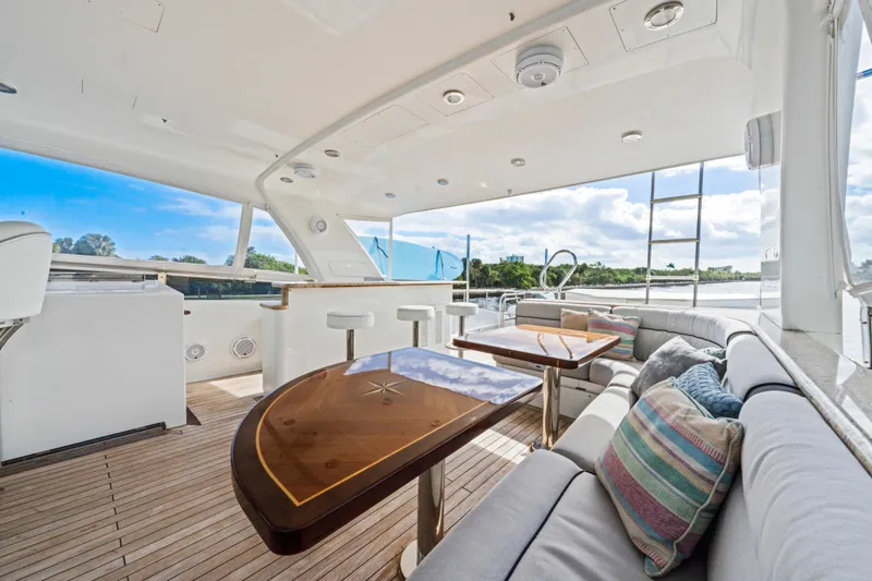 Slide: The Image of Luxurious 2006 Cheoy Lee 84 Bravo yacht interior with bar and seating area. - 29