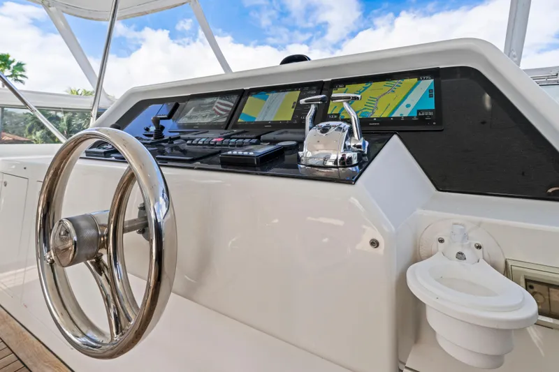 Slide: The Image of Helm of 2006 Cheoy Lee 84 Bravo yacht with navigation screens and controls. - 32