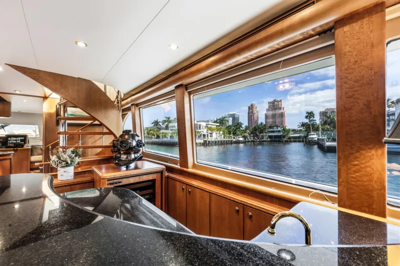 Slide: The Image of Luxurious wooden staircase inside 2006 Cheoy Lee 84 Bravo yacht, featuring elegant design and lighting. - 36