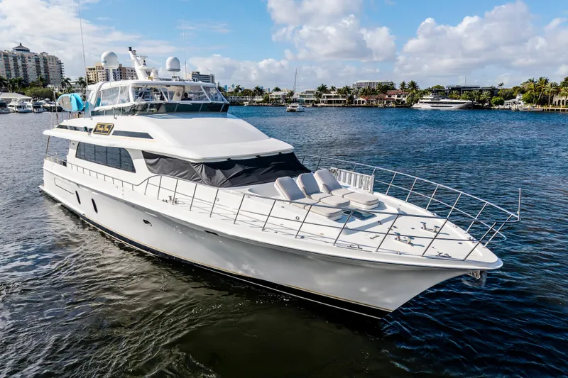 Slide: The Image of 2006 Cheoy Lee 84 Bravo yacht on water, city skyline in background. - 4