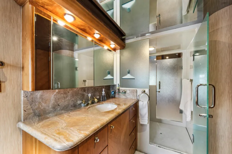 Slide: The Image of Luxurious 2006 Cheoy Lee 84 Bravo yacht bedroom with elegant wood finishes and modern decor. - 45