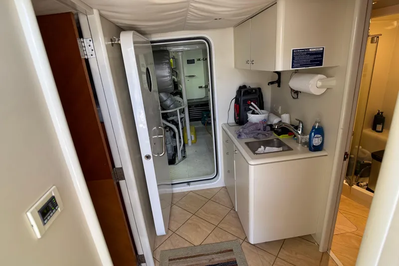 Slide: The Image of Bathroom and sink area on 2006 Cheoy Lee 84 Bravo yacht, featuring modern amenities. - 53