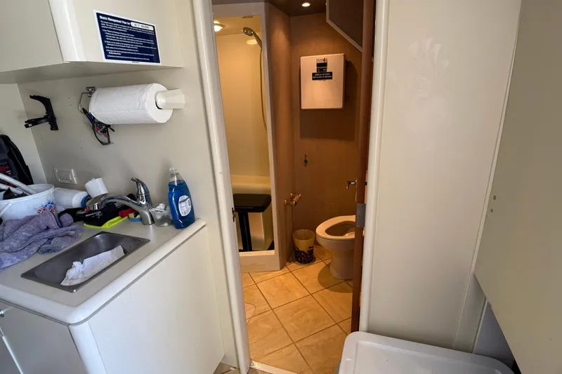 Slide: The Image of 2006 Cheoy Lee 84 Bravo yacht cabin with wooden interior and single bed. - 54