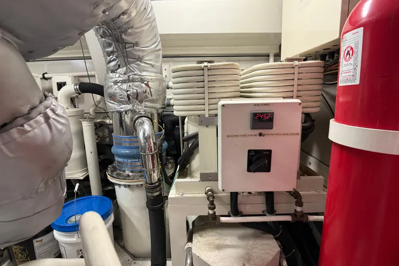 Slide: The Image of Electrical panel and fire extinguisher in 2006 Cheoy Lee 84 Bravo yacht engine room. - 59