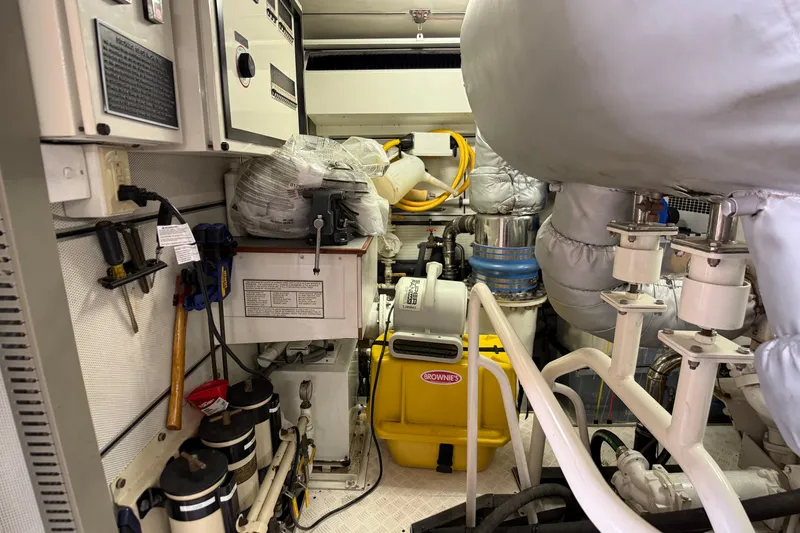 Slide: The Image of Engine room of 2006 Cheoy Lee 84 Bravo yacht with machinery and equipment. - 61