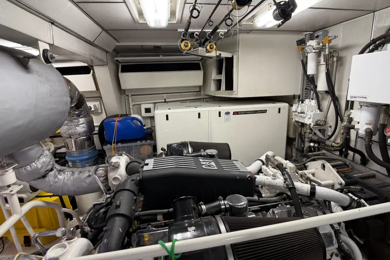 Slide: The Image of Engine room of 2006 Cheoy Lee 84 Bravo yacht, featuring advanced machinery and equipment. - 63