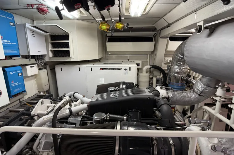 Slide: The Image of Engine room of 2006 Cheoy Lee 84 Bravo yacht, featuring machinery and equipment. - 64