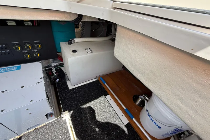 Slide: The Image of 2022 Regal 36 XO boat interior showing control panel and storage area. - 12