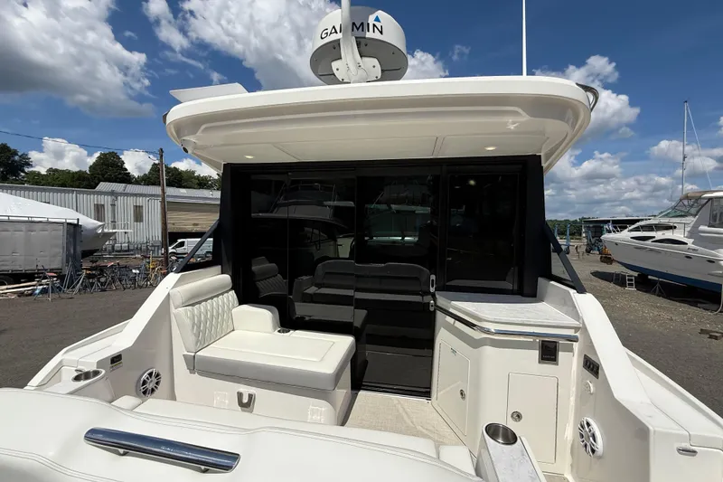 Slide: The Image of 2022 Regal 36 XO yacht with spacious seating and modern design. - 16